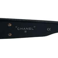 Lunette de soleil Coco mark CC en acétate noir et finitions dorées
