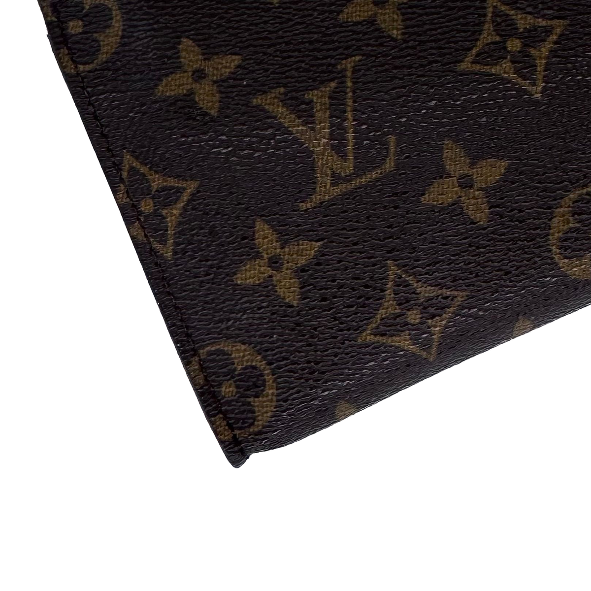Pochette à maquillage PM, gros plan de la toile Monogram enduite